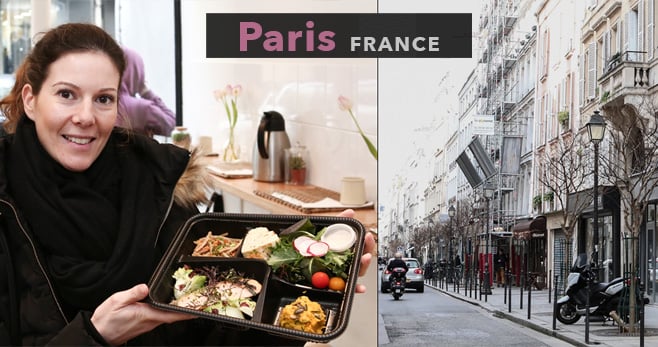 Paris FRANCE 写真：お弁当の中身を見せている女性とパリの街並み